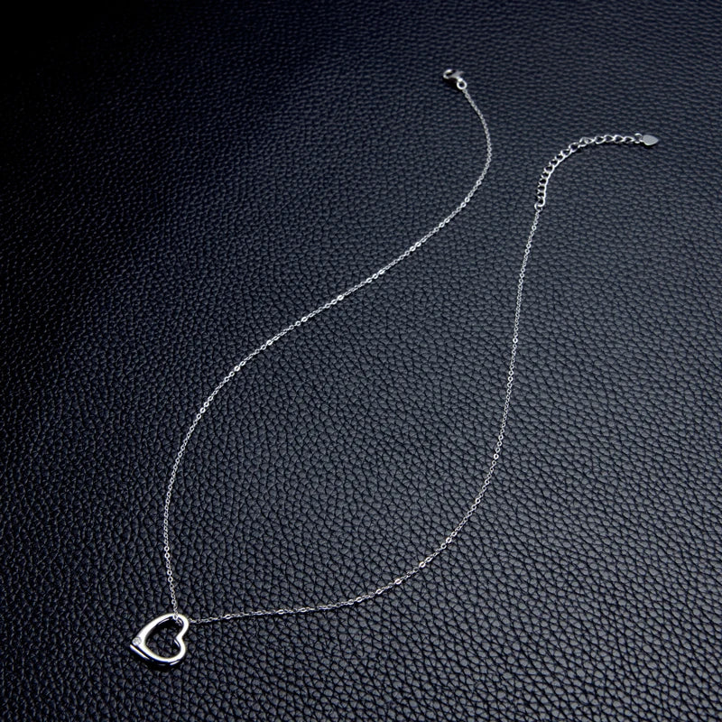 Enhanced product title: Elegant Women's Heart Necklace with Dazzling 2.3mm Round Cut Moissanite Pendant - Exquisite 925 Sterling Silver Jewelry